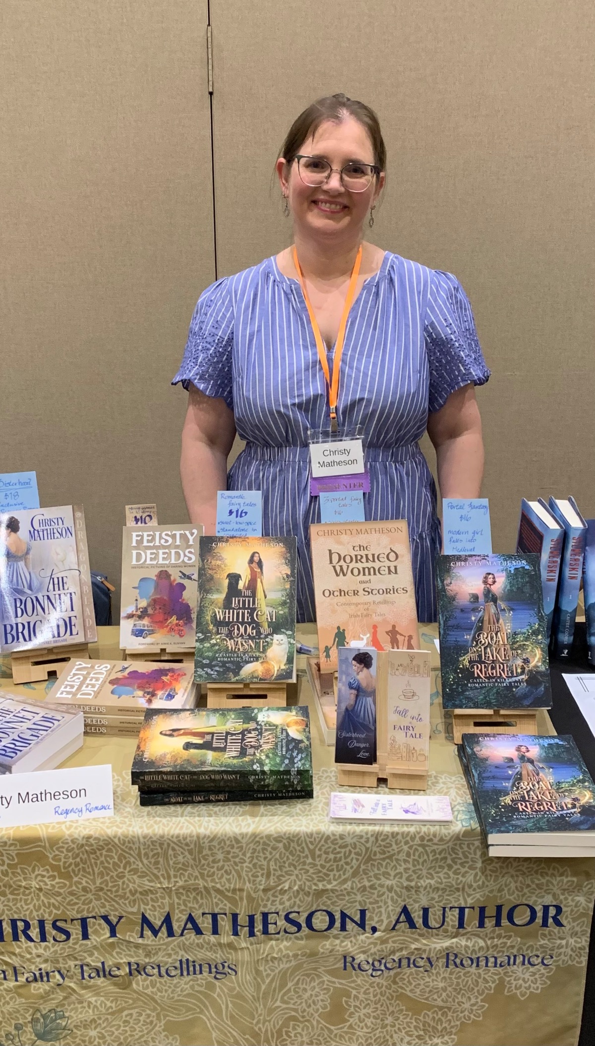 me in front of table with books