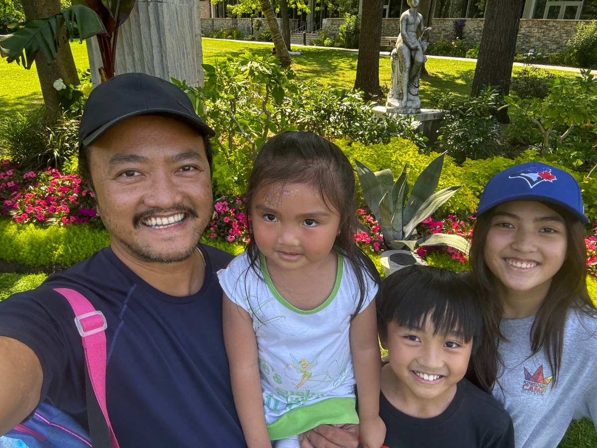 dad with kids in a park
